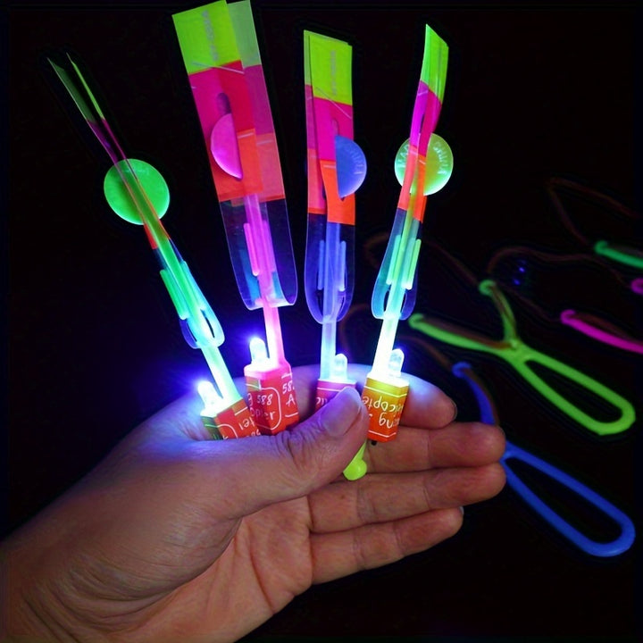 8pcs, Led Lighting Up Luminous Toy, Flying Slingshot, Flying Toys, Fast Catapult Luminous Toy, Glow In Dark Party Supplies, Party Favors, Holiday Gifts, Children Gifts, Outdoor Luminous Toys