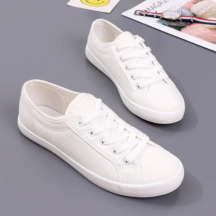 Unisex White Canvas Sneakers 👟
Classic, comfy, and versatile. These lace-up vulcanized shoes are perfect for students and everyday wear. Great fit for both men and women!