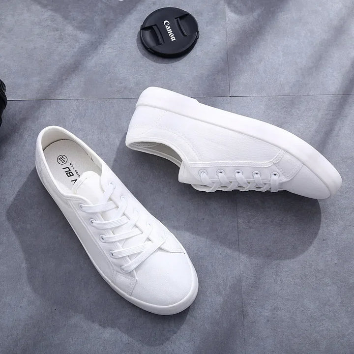 Unisex White Canvas Sneakers 👟
Classic, comfy, and versatile. These lace-up vulcanized shoes are perfect for students and everyday wear. Great fit for both men and women!