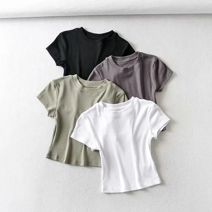 Turn Up the Heat in Style
This slim-fit, stretchy crop top features a sexy O-neck and short sleeves — perfect for summer days and night-outs. Soft, flattering, and made to hug your curves. ☀️👚