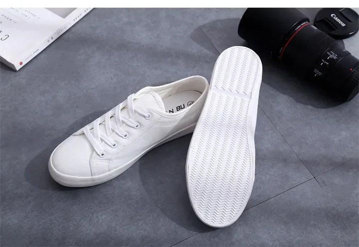 Unisex White Canvas Sneakers 👟
Classic, comfy, and versatile. These lace-up vulcanized shoes are perfect for students and everyday wear. Great fit for both men and women!
