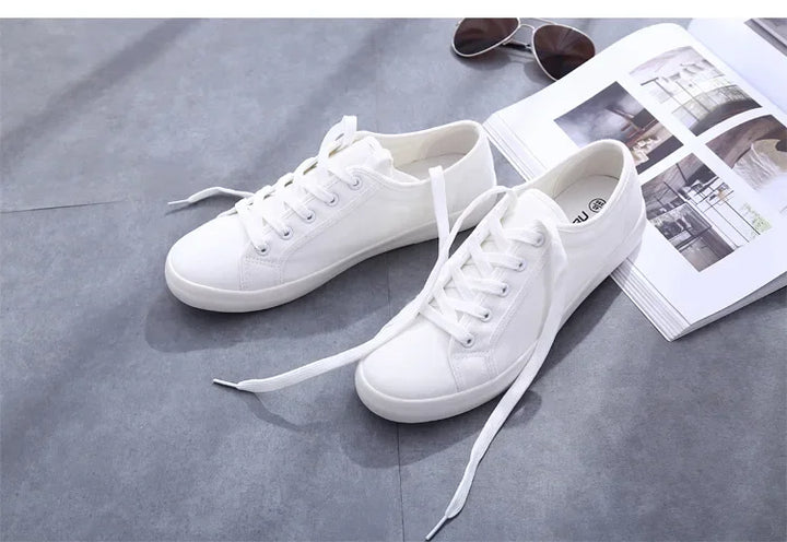 Unisex White Canvas Sneakers 👟
Classic, comfy, and versatile. These lace-up vulcanized shoes are perfect for students and everyday wear. Great fit for both men and women!