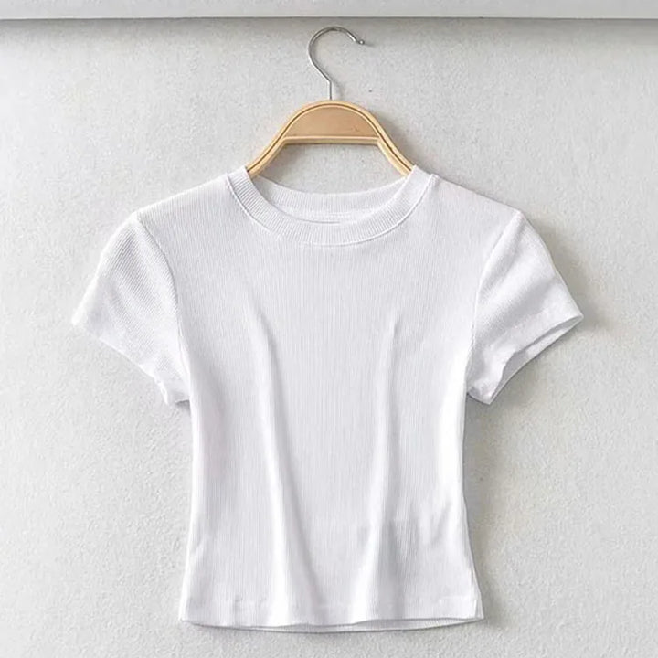 Turn Up the Heat in Style
This slim-fit, stretchy crop top features a sexy O-neck and short sleeves — perfect for summer days and night-outs. Soft, flattering, and made to hug your curves. ☀️👚