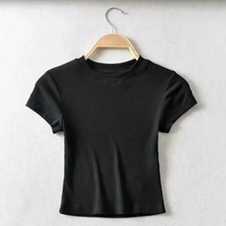 Turn Up the Heat in Style
This slim-fit, stretchy crop top features a sexy O-neck and short sleeves — perfect for summer days and night-outs. Soft, flattering, and made to hug your curves. ☀️👚