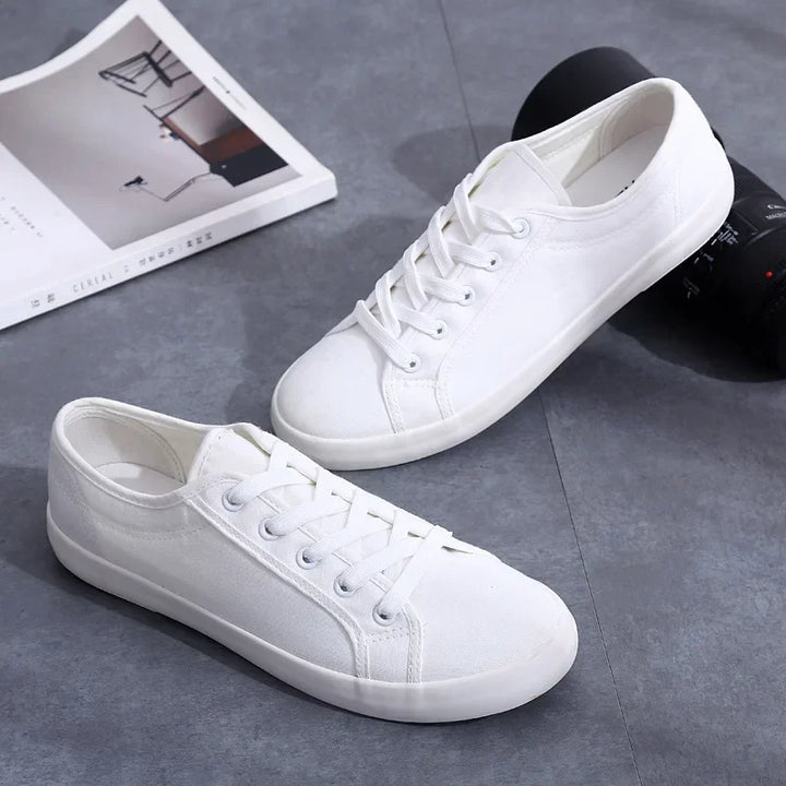 Unisex White Canvas Sneakers 👟
Classic, comfy, and versatile. These lace-up vulcanized shoes are perfect for students and everyday wear. Great fit for both men and women!
