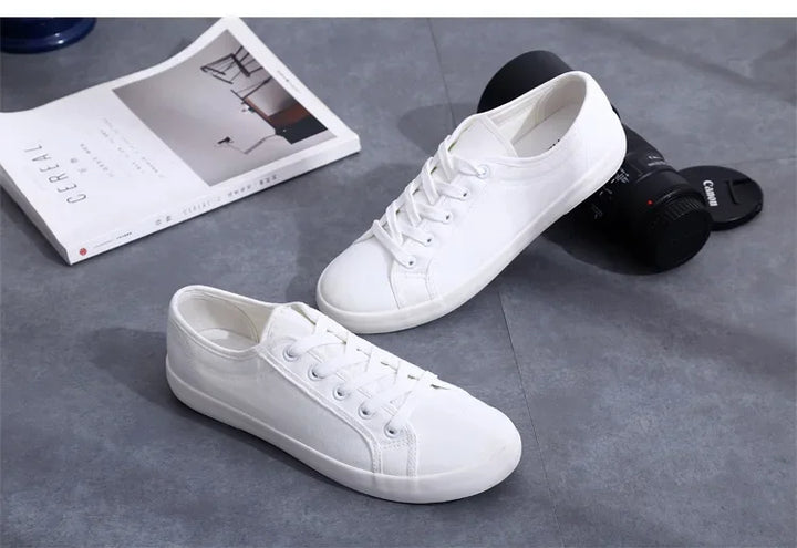 Unisex White Canvas Sneakers 👟
Classic, comfy, and versatile. These lace-up vulcanized shoes are perfect for students and everyday wear. Great fit for both men and women!