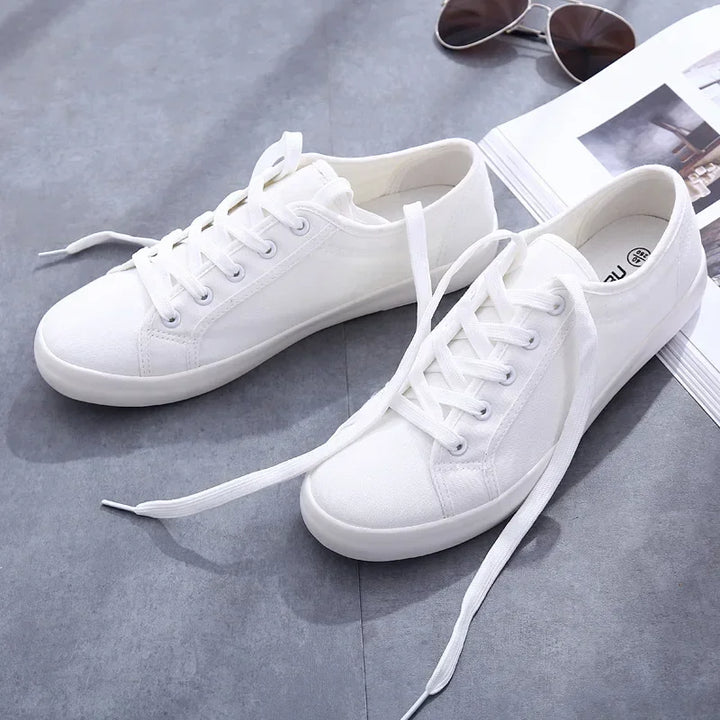 Unisex White Canvas Sneakers 👟
Classic, comfy, and versatile. These lace-up vulcanized shoes are perfect for students and everyday wear. Great fit for both men and women!