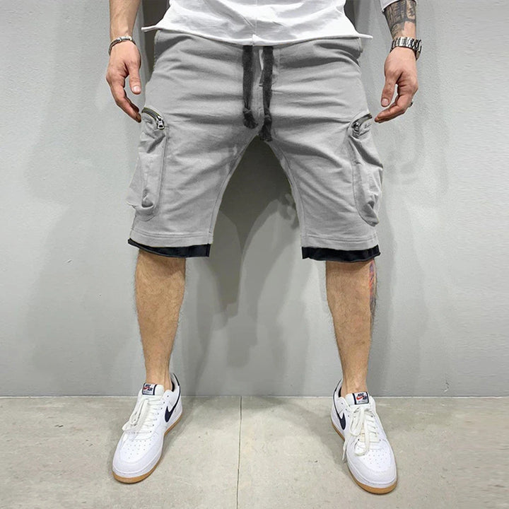Men’s Summer Cargo Shorts 🟡
Stay cool and active in these breathable cotton shorts. Perfect for workouts, jogging, or casual wear. Features multiple pockets for convenience and style.