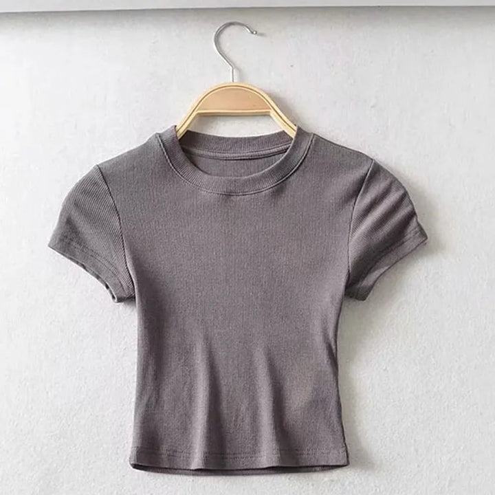Turn Up the Heat in Style
This slim-fit, stretchy crop top features a sexy O-neck and short sleeves — perfect for summer days and night-outs. Soft, flattering, and made to hug your curves. ☀️👚
