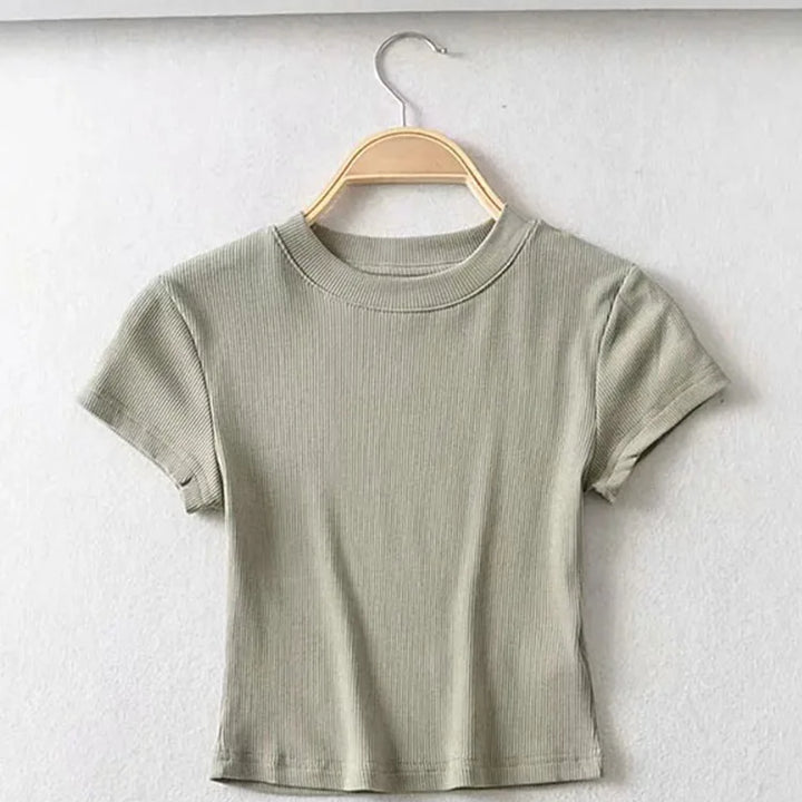 Turn Up the Heat in Style
This slim-fit, stretchy crop top features a sexy O-neck and short sleeves — perfect for summer days and night-outs. Soft, flattering, and made to hug your curves. ☀️👚